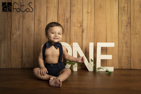 one year pre-birthday photoshoot of baby boy with ONE in Nagpur.